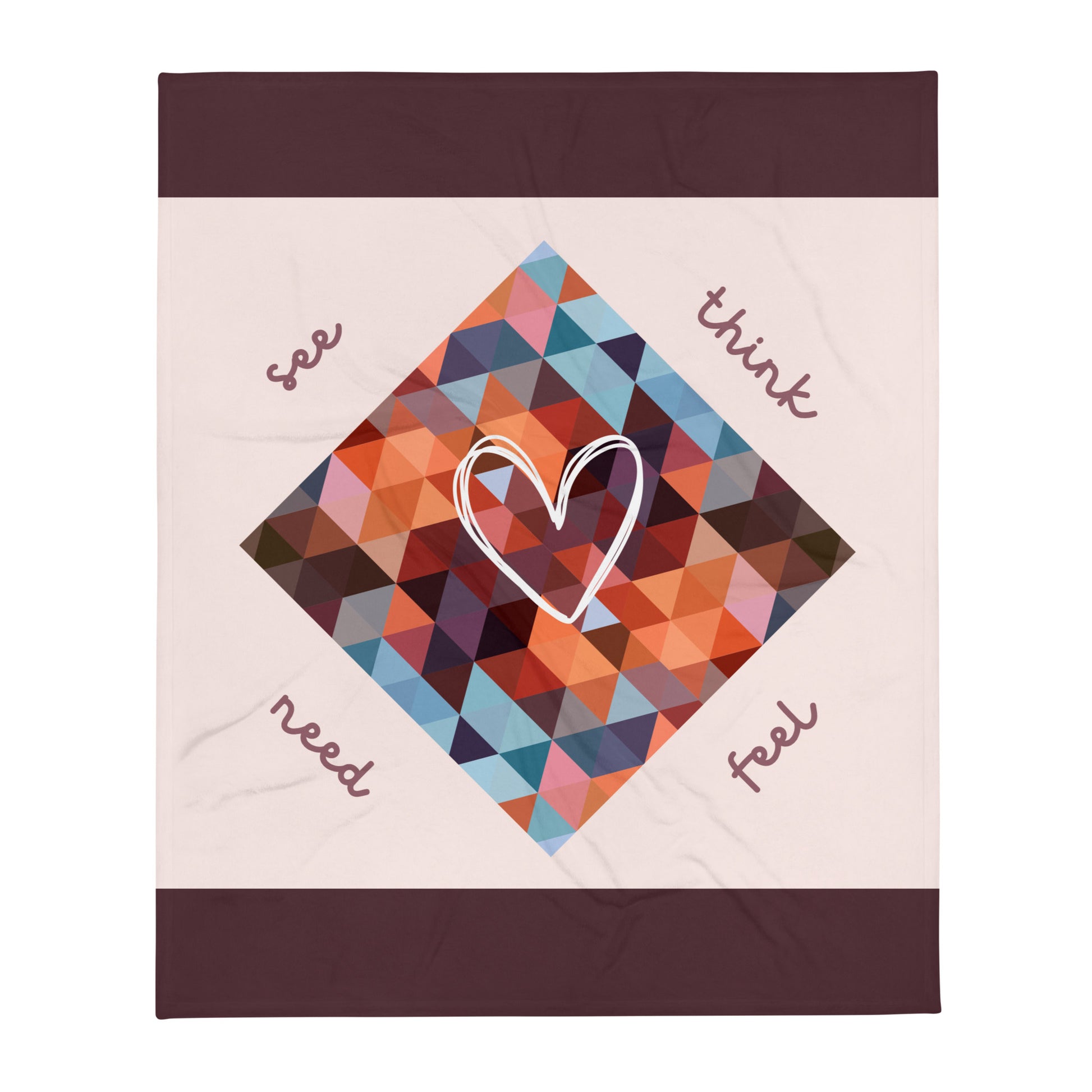 Colorful geometric-patterned communication blanket in pink. The blanket features a communication tool printed in the design for emotional regulation. 